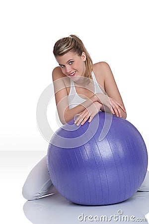 Fitness â€“ Young woman with exercise ball on whit Stock Photo